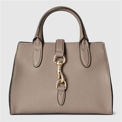 gucci 1298060505|Gucci Medium tote bag with hook closure.